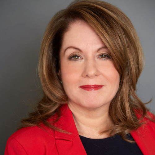 Katherine Graham-Leviss, President and Founder at XBInsight seen in a bright red color outfit